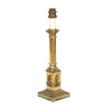 A gilt metal Corinthian column table lamp, 30cms high.