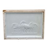 An early 20th century relief moulded plaster panel depicting a group of horses, indistinct