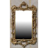 A Victorian style gilt gesso rectangular wall mirror, the plate size 53 by 38cms.