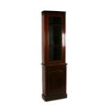 A Victorian mahogany bookcase on cupboard, of tall narrow proportions, 67cms wide.