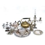 A large quantity of silver plate to include teapots, candlesticks, biscuit barrel, flatware.