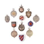 A group of silver sporting fobs and medallions; together with three silver Gloucestershire Ladies