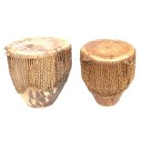 Two African hide drums, the largest 36cms high; together with two Tongan Kankobela (4).