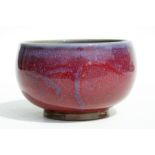 A Chinese Jun ware style bowl with mottled red and blue glaze, 14cms diameter.