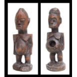 African Art / Tribal Art: a pair of carved wooden Lobi male and female figures , each 31cms high. (