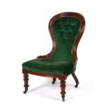 A Victorian walnut buttoned spoon-back chair with upholstered seat and back, on turned front