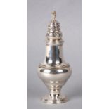 A George III silver sugar caster with indistinct London hallmark and makers mark for Thomas Daniell,