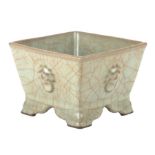 A Chinese celadon crackle ware planter of square tapering form, 10cms high.