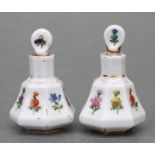 A pair of late 19th century Meissen miniature scent bottles & stoppers decorated with flowers and