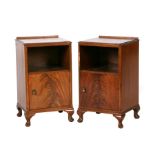 A pair of figured mahogany pot cupboards with Gimson & Slater labels, 41cms wide (2).