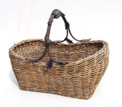 A woven wicker basket with metal and glass handles, 60cms wide.