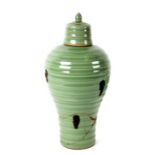 A Chinese celadon glaze ribbed baluster vase and cover (a/f), 27cms high.