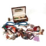 A quantity of costume jewellery to include earrings, necklaces, brooches and other items.