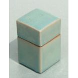 A Chinese celadon glaze box and cover of square form, 11cms high.