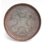 A large copper Persian / Iznik circular copper tray with pinched rim and impressed decoration, 54cms
