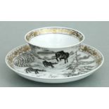 A Chinese en grisaille buffalo pattern tea bowl and saucer decorated with buffalos in a landscape