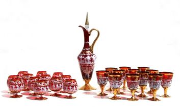 A suite of Murano glassware to include wine ewer, wine glasses and brandy glasses, decorated with