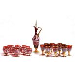 A suite of Murano glassware to include wine ewer, wine glasses and brandy glasses, decorated with