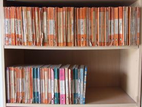 A quantity of vintage Penguin books to include authors Graham Green, George Orwell and D H