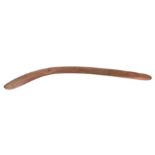 An Australian Aboriginal boomerang with simple decoration, 77cms long.