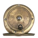 An FT Williams & Co. brass fishing reel, 7.5cms diameter.
