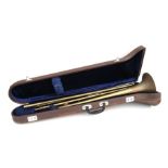 A Lark brass trombone, no: 4027, cased.