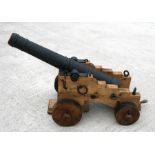 An ornamental 18th century style cannon. Having a black painted reinforced concrete tapering