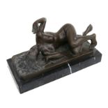 After Milo - a bronze study of a recumbent naked female on a marble plinth, 27cms wide.