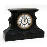 A Victorian American painted cast iron mantle clock, the white enamel dial with Roman numerals,