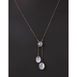 An Edwardian moonstone pendant drop necklace.Condition ReportThere looks to be an old repair to