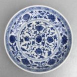 A Chinese blue & white shallow dish decorated with scrolling flowers, blue seal mark to the