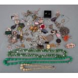 A quantity of costume jewellery to include necklaces, bracelets, pendants and rings.