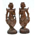 A pair of Thai carved wooden temple figures, each approx 47cms high (2).