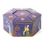 A group of Chinese cloisonne enamel boxes decorated with figures and flowers on a blue ground, seven