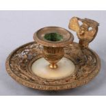 A 19th century pierced brass and mother of pearl chamberstick, 13cms diameter.