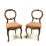 A pair of Victorian balloon back chairs, a three tier occasional table together with a fire