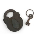 A Victorian cast iron padlock and key, 11.5cms high.
