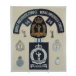 A group of Royal Observer Corps cap badges, badges and cloth badges, mounted on card.