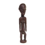 African Art / Tribal Art: a carved wooden female figure, 43cms high.