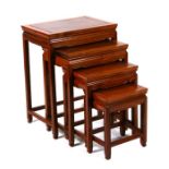 A nest of four Chinese hardwood graduated tables, the largest 50cms wide.