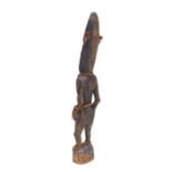 Oceanic Art / Tribal Art: a carved wooden PNG Sepik male ancestor figure, 53cms high.