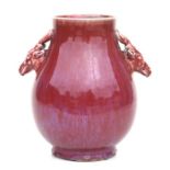 A Chinese flambé glaze vase with two applied deer head handles, 27cms high.Condition ReportThe snout