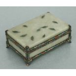 A Chinese gilt metal and enamel mounted green soapstone box with applied leaf decoration, 14cms