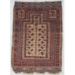 A Persian Baluch tree prayer rug on a beige ground, 154 by 91cms; together with a small hand knotted