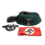 A WWII German 13th Waffen Mountain Division fez with SS Handschar, armband and eagle insignia,
