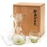 A Japanese Niijima glass turban shell cup and bottle, the glass 7cms, the bottle 18cms, in