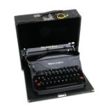 A vintage Mercedes portable typewriter.