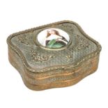 A 19th century continental gilt metal trinket box, the top set with a porcelain roundel depicting