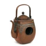 An unusual Japanese copper teapot with internal burner, 19cms high.