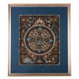 A hand painted Tibetan thangka decorated with a central seated Buddha surrounded by smaller